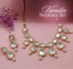 Step into elegance with our Pearl Uncut Kundan Necklace Set, part of our Luxe Royal Heritage collection, a stunning fusion of luxury and grace. Crafted meticulously, this necklace set captures the essence of American chic and Indian artistry. The soft hues of pink and radiant gold intertwine seamlessly, offering a touch of opulence to any ensemble. Lightweight and refined, they embody sophistication and cross-cultural allure, making every moment a statement of timeless beauty. Handcrafted Metal: Elegant Luxury Pink Kundan Necklace, Hand Harness, Kundan Necklace Set, Bangle Ring, Kundan Necklace, Kundan Necklaces, Foot Jewelry, Heritage Collection, Gold Plated Necklace