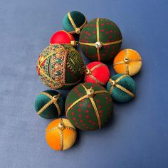 several ornaments are arranged on a blue surface