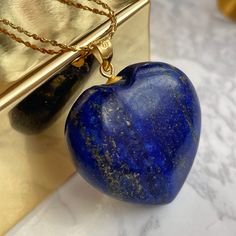 Luxury Lapis Lazuli Heart pendant featuring 18k gold filled 'star' chain over sterling silver. A deep blue stone from Afghanistan. This stone has the powers to heal and build any relationship! Comes in branded gift box and postcards. A great gift for those who want to show some attention and love to the recipient. 🌀The benefits of wearing LAPIS LAZULI jewelry: ➜ Lapis Lazuli stones are believed to help bring about harmony in relationships. ➜This is also a stone of sincerity and purity. It offer Blue Heart Necklace, Necklace Luxury, Lapis Lazuli Jewelry, Star Chain, Silver Anniversary, Lapis Lazuli Stone, Gold Sparkle, Beautiful Gifts, Blue Heart