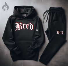 Looking for the Fire! combo to complete your 4’s fit? Look no further than this ultra-black BRED Hoodie and Jogger Sweatsuit to match Air Jordan Retro 13 Bred. This essential men’s sweatsuit set to match sneakers is crafted from comfy fleece, keeping you cozy while you rep your Jordans in style. The clean black design ensures your Retro 4s are the true stars of the show. Here's why you need this sneakerhead sweatsuit: Clean black design: Lets your Retro 6s steal the spotlight. Comfy fleece: Stay Black Tracksuit With Letter Print For Streetwear, Black Hooded Tracksuit For Gym, Black Letter Print Tracksuit For Streetwear, Black Hooded Tracksuit For Winter, Black Hooded Winter Tracksuit, Black Hooded Tracksuit For Streetwear, Black Tracksuit For Streetwear In Winter, Black Tracksuit For Winter Streetwear, Black Hooded Tracksuit For Sports