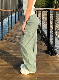 THESE WIDE LEG CARGO PANTS OFFER A STYLISH AND COMFORTABLE FIT WITH THEIR RELAXED, ROOMY DESIGN. THE FRONT FEATURES CLASSIC CARGO POCKETS FOR A FUNCTIONAL TOUCH, PERFECT FOR STORING ESSENTIALS. THE HIGH WAIST AND SECURE BUTTON-FLY CLOSURE PROVIDE A FLATTERING SILHOUETTE. THE BACK VIEW MAINTAINS A CLEAN LOOK, WITH ADDITIONAL POCKETS FOR ADDED UTILITY. THE SOFT, DURABLE FABRIC ENSURES ALL-DAY COMFORT, MAKING THESE PANTS IDEAL FOR CASUAL WEAR OR OUTDOOR ADVENTURES. PAIR THEM WITH A CROPPED TOP OR A Wide Leg Cargo Pants, Inside Shop, Pants Large, Back View, Cargo Pant, Cropped Top, Outdoor Adventures, Casual T Shirts, Every Woman