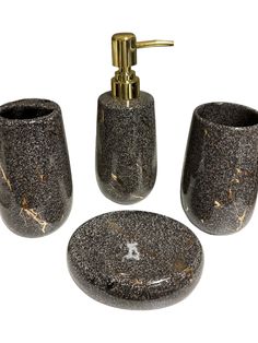 three pieces of bathroom accessories in black and gold speckles