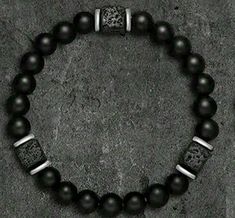 Elevate your style and well-being with our Black Obsidian Bracelet, meticulously crafted for men seeking both elegance and tranquility. This striking wristband features volcanic beads known for their grounding properties, perfectly paired with the powerful Black Obsidian stones, renowned for their ability to release negative emotions and promote overall body relaxation. Obsidian Bracelet Men, Black Obsidian Bracelet, Black Obsidian Stone, Obsidian Bracelet, Obsidian Stone, Gift For Father, Bracelet Men, Black Obsidian, Negative Emotions