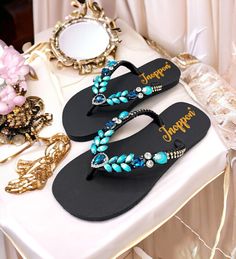 Description The beautiful rhinestone and customizable Flip Flops for the beach brides, bridesmaids, vacation, honeymoon or any occasion you desire to look gorgeous. Perfect in any outfit! Being unique and stunning on design, these flip flops must be your must-have item! The sandal is anti-slip, comfortable and durable as it is made from high quality rubber from the South of Thailand, where is famous for the best rubber tree. Moreover, the crystals are decorated on the sandal with effective adhes Embellished Sandals For Beach Party, Embellished Sandals For Beach Season Parties, Elegant Rhinestone Sandals For Beach Season, Embellished Open Toe Flip Flops For Vacation, Embellished Flip Flops With Round Toe For Beach, Embellished Flip Flops For Beach, Beach Embellished Flip Flops, Adjustable Rhinestone Flip Flops For The Beach, Adjustable Sandals With Rhinestones For Beach Season