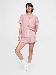 Soft cotton flannel pajama shirt and shorts set.  Notch collar, button front.  Short sleeves.  Patch pocket at chest.  Elasticized waist with drawcords at PJ shorts.  Allover print.  Note: This pajama set comes pre-wrapped and ready to gift for the holiday season.  Fit: Relaxed.  An easy silhouette throughout.  Models wearing Gap Cute Pajamas Shorts, Pj Shorts Set, Flannel Pjs, Easy Silhouette, Shirt And Shorts Set, Red Pajamas, Pj Shorts, Candy Cane Stripes, Long Sleeve And Shorts