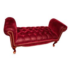 a red velvet bench with gold trimmings