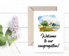 a card with the words welcome to our congregation on it next to a bouquet of flowers