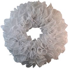 a white wreath with bows on it