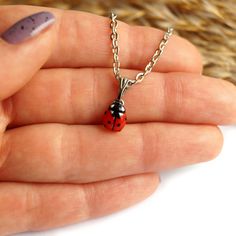 This miniature necklace with a ladybug is made and painted by hand. The size of the ladybug is about 8 mm (0.3 in), The length of the necklace is adjustable from 16 to 19 inches, Materials: polymer clay, metal chain. ♥ Ladybug Stud Earrings https://www.etsy.com/listing/583555073 ♥ Ladybug Ring https://www.etsy.com/listing/661389811  Other necklaces you can see here: https://www.etsy.com/shop/RinaStudioDesign?section_id=24005632 * Submersion in water is not recommended for polymer clay as this will quickly deteriorate the product. It is recommended that you remove the necklace prior to swimming or showering to extend the life of the product. * Please, note that given the varying monitor settings, the colours displayed on your screen might differ slightly from the real ones. * All items are Ladybug Ring, Ladybug Necklace, Jewelry Valentines Day, Nose Ring Jewelry, Petite Jewelry, The Ladybug, A Ladybug, Tiny Pendant, Bear Outfits