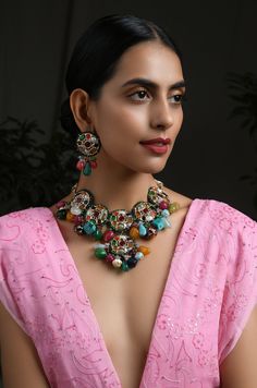 Multicoloured Navrattan Kundan Inspired Necklace with Earrings. This beautifully handcrafted necklace is set in silver and copper alloy and plated with 22k gold. This necklace with a twist of Pearl stones by Paisley Pop is a perfect accessory for an Indian Bride. LENGTH Necklace Size - Length 16 inches Closure - Adjustable Thread Dori DETAILS -100% top Quality Faux Glass Polki -22K gold and silver Plated silver copper alloy. -Handcrafted in our all girls workshop in Paisley Pop Studio, Jammu and Elegant Multicolor Jewelry For Rituals, Multicolor Meenakari Metal Jewelry, Multicolor Metal Jewelry With Meenakari, Multicolor Metal Meenakari Jewelry, Multicolor Temple Jewelry Pendant Necklace, Traditional Multicolor Multi-stone Jewelry Set, Traditional Multicolor Jewelry For Rituals, Multicolor Fusion Jewelry With Multi-stone, Traditional Colorful Beads Jewelry For Rituals