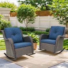 two wicker rocking chairs with blue cushions