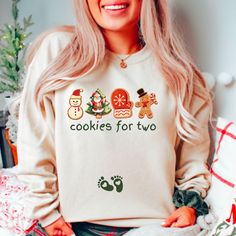 Celebrate the holiday season wearing our funny christmas pregnancy sweatshirt. This shirt is perfect way to break the baby news! This merry and pregnant sweater makes a great gift for a reveal party, daughter or friend who is expecting a new baby and of course yourself! -These sweatshirts are Unisex Adult Sizing (not women's fitted sweatshirt ). If you're going for a more fitted look, we suggest to size down.Please use the measurements chart in the pictures section to determine your correct size. NOTE ABOUT SIZING: These are NOT a maternity style shirt . These sweatshirts  are unisex fit. -Props used In photos  are NOT included with purchase. -Care Instructions: Wash inside out in cold water, gentle cycle, tumble dry low or let air dry. Do not iron on design. If you have any questions, ple Pregnant Christmas Outfit, Pregnancy Sweatshirt, Christmas Baby Reveal, Cookies For Two, Announcement Photoshoot, Baby Announcement Photoshoot, Christmas Baby Announcement, Measurements Chart, Baby News