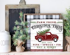 a christmas tree sign sitting on top of a shelf