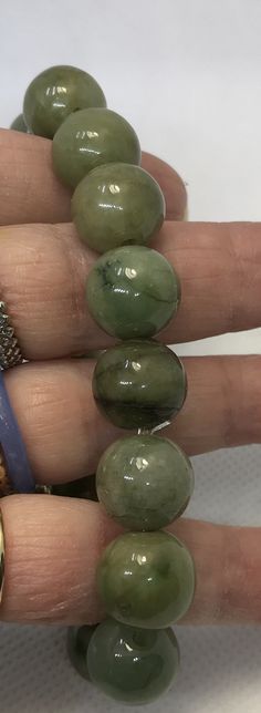 Beautiful, big, heavy jade beads. Jade Stretch Bracelet For Healing With Round Beads, Jade Gemstone Beads Stretch Bracelet, Jade Stretch Bracelet With Gemstone Beads, Jade Stretch Bracelet With 8mm Beads, Disney Charms, Sterling Bracelets, Cameo Pendant, Yellow Gold Chain, Jade Beads