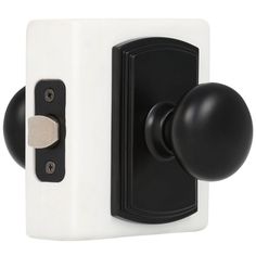 a black and white door handle with a round knob on the left side of it