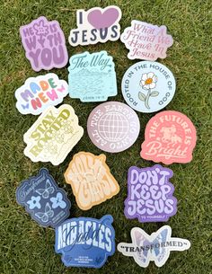 various stickers that say i love jesus on the grass