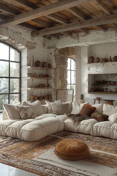 a living room filled with furniture and lots of windows