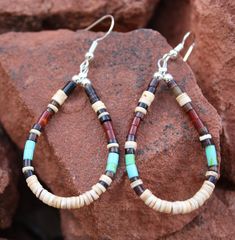 "Heishi and shell pueblo earrings. Tribal colors. Simple and earthy. Everyday hippie earrings. - 2 1/2\" X 1\" -silver tone metal earring hooks - comes in nice presentation box Check out the rest of our collection: https://www.etsy.com/shop/NewMexicoGems Thank you for your business. We appreciate you." Native Earrings, Beaded Jewelry Bracelets, Wire Wrapped Jewelry Diy, Beaded Earrings Diy, Native American Earrings, African Earrings, Hippie Earrings, Homemade Jewelry, Pretty Bracelets