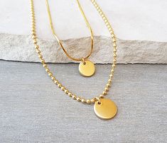 "Delicate, minimal set of 2 layering necklaces in 14k gold filled, necklaces are individual, so you can wear them separately or layered together. The first necklace features a 14k gold filled snake chain and a tiny 10x1.5mm gold disc. The second necklace features a 14k gold filled ball chain and a small 12x1.5mm gold disc. Layered necklace easy-to-wear and super chic. Available also in Sterling Silver see the last picture in the silver option - choose from the menu. LENGTH - Please choose from t Gold Layered Necklaces, Necklaces Set, Delicate Gold Necklace, Necklace Everyday, Layering Necklaces, Layered Necklace Set, Packing Jewelry, Ball Chain Necklace, Gold Disc