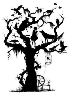 a black and white photo of a tree with halloween decorations