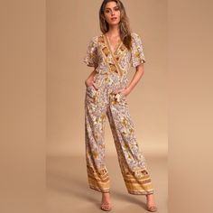 Has Cute Little Back Cutout And Tassels On The Waist Ties . Size Small, But Can Fit A Medium. Spring Yellow Jumpsuits And Rompers With Pockets, Fitted Yellow Overall Jumpsuits And Rompers, Yellow Fitted Jumpsuit Romper Overall, Yellow Fitted Overall Jumpsuit, Casual Yellow Printed Jumpsuits And Rompers, Yellow Short Sleeve Jumpsuits And Rompers For Vacation, Bohemian Jumpsuits And Rompers With Pockets For Spring, Casual Yellow Floral Print Jumpsuits And Rompers, Spring Festival V-neck Jumpsuits And Rompers