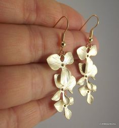 Cascading Orchid Flower Gold Earrings, Wedding Bride or Bridesmaid Gift Under 40 Delicate Dangle Flower Earrings For Bridesmaids, Elegant Gold Flower Earrings For Wedding, Elegant Orchid Flower Jewelry, Elegant Orchid Flower Earrings, Wedding Flower Dangle Earrings In Gold Plated, Gold Dangle Flower Earrings For Wedding, Gold Flower Earrings For Bridesmaid Gift, Silver Gold-plated Flower Earrings For Wedding, Gold Plated Dangle Flower Earrings For Wedding