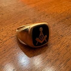 Ring Size Is Approximately 8-9. There Is A Slight Bend On The Underside That Can Be Easily Fixed By A Jeweler. This Vintage Masonic Freemason Ring Is A Unique Piece Of Historical Memorabilia That Any Collector Would Be Proud To Add To Their Collection. The Ring Is Crafted From 14k Yellow Gold, Making It A Durable And Valuable Piece For Years To Come. The Design Features The Symbolic Masonic Emblem, Making It A Perfect Gift For Any Masonic Enthusiast Or Collector. This Rare Item Is Sure To Spark Conversation And Interest, And Would Make A Great Addition To Any Collection Of Rings And Watches. Freemason Ring, Masonic Freemason, Yellow Gold Color, Mens Accessories Jewelry, Bend, Design Features, Unique Pieces, Gold Color, Mens Accessories