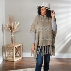 The Khaki Meegan Poncho can be worn for fashion, warmth, and comfort during the fall and winter months. Add a stylish touch to an outfit for any occasion—an casual evening out, at the office, or for a casual weekend brunch. Poncho is one size fits most and is made of 100% Acrylic 35.5" x 27.5" Colors: Khaki Material: 100% Acrylic Care: Hand Wash One Size Fits Most One Size Knit Outerwear For Fall, Casual One Size Poncho With Fringe, Casual One-size Poncho With Fringe, Bohemian Beige Poncho For Fall, One Size Casual Poncho For Spring, Knit Outerwear With Fringe For Fall, Knit Fringe Outerwear For Fall, Casual One-size Poncho For Layering, Oversized Fringe Poncho Casual Style