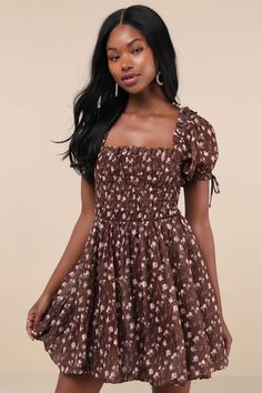 You'll be the first thing on your sweetie's mind in the Lulus Delightful Crush Brown Floral Smocked Puff Sleeve Mini Dress! Lightweight woven fabric, with a burnout design and ditsy floral print throughout, shapes short puff sleeves with elastic cuffs and bow details. Ruffle-trimmed square neckline tops a smocked bodice with a fitted waist. Flaring skirt finishes at a bubble-style mini hem. Fit: This garment fits true to size. Length: Mid-thigh. Size medium measures 26.5" from shoulder to hem. B Cute Fitted Smocked Dress With Ruffle Hem, Cute Fitted Smocked Mini Dress, Cute Flowy Dress With Smocked Bodice, Cute Smocked Spring Dress With Ruched Details, Cute Mini Smocked Dress With Smocked Bodice, Cute Dresses With Smocked Bodice For Brunch, Cute Smocked Puff Sleeve Fitted Dress, Cute Smocked Puff Sleeve Dress, Cute Fitted Smocked Dress With Puff Sleeves