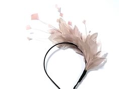 Pale pink feather fascinator This lovely pale pink feather fascinator I made from high quality feathers which are attached to the fabric covered metal headband. Pale pink feather fascinator can be suitable for the Bridesmade, Mother of the Bride, Garden party or a Ladies day at the races. Its very elegant, made from high quality feathers. Pink feather fascinator will fit an average head size. Enjoy your special day with this beautiful fascinator! Pink Crown-shaped Headband For Party, Pink Feather Trim Headpieces For Party, Whimsical Pink Crown Headpiece, Whimsical Pink Headband Fascinator, Whimsical Pink Headpiece With Matching Headband, Pink Crown Headpiece For Wedding, Pink Whimsical Headband Headpiece, Pink Crown Headband For Party, Pink Wedding Crown Headpiece