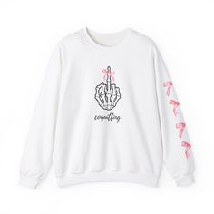 "Step into the spotlight of rebellious style with our exclusive \"Coquitting\" Crewneck Sweatshirt, a daring fusion of bold attitude and coquettish charm. The front proudly displays a cheeky skeleton hand giving the middle finger, adorned with an enchanting pink bow, making this sweatshirt a statement piece for those who love to make a statement and stand out in a crowd. Crafted for both comfort and flair, this pullover crewneck sweatshirt embraces the trendsetting coquette aesthetic while defyi Punk Crew Neck Tops For Winter, Winter Crew Neck Punk Tops, Fall Punk Style Crew Neck Top, Punk Style Crew Neck Tops For Fall, Punk Style Letter Print Fall Sweatshirt, Punk Letter Print Sweatshirt For Fall, Punk Style Letter Print Sweatshirt For Fall, Edgy Long Sleeve Sweater With Graphic Print, Edgy Long Sleeve Tops With Letter Print