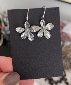 "Sterling silver flower dangle earrings are finished with sterling silver lever backs for a secure wear.  These earrings make a sweet gift for a nature lover, gardener or a special girl on any occasion. The earrings measure approx 1.5\" from end to end and are approx 1\" wide. You may also like to check out more of my earrings here: http://etsy.me/2oDJlWy Free USPS First Class shipping within the USA." Flower Dangle Earrings, Botanical Earrings, Botanical Jewelry, Special Girl, Silver Dangle Earrings, Handmade Jewelry Gift, Sterling Silver Dangle Earrings, Sterling Silver Flowers, Floral Jewellery