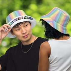 The perfect accessory for anyone who loves rainbows and isn't afraid to show off their pride! Our pastel rainbow bucket hat is the ultimate statement piece, featuring a bold and colorful design that's sure to turn heads. And with the playful message "Nobody Knows I'm Gay" emblazoned across the brim in matching pastel rainbow font, you can let the world know your true colors without saying a word.But that's not all – this versatile hat is also reversible, with a classic white side that lets you s Rainbow Bucket Hat, Remove Labels, Nobody Knows, Love Rainbow, Pride Parade, Rainbow Flag, Fun Loving, Colorful Design, Beach Days