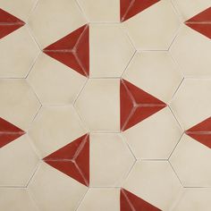 a red and white tile pattern on the wall