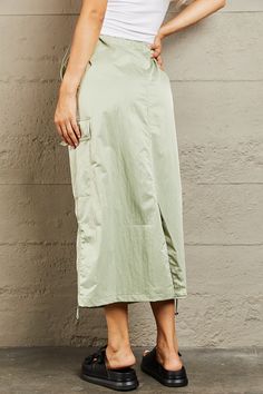 Crafted with a flattering high-waist design, this midi skirt accentuates your curves while offering a comfortable fit. The elastic scrunch detail adds a touch of elegance and ensures a secure fit around the waist. With ample cargo pockets, it's both fashionable and practical, providing ample space for your essentials while adding a trendy utilitarian edge to your outfit. Whether you dress it up for a chic evening look or go casual for a day out, this midi skirt is a wardrobe must-have for every Cargo Midi Skirt, Maxi Dress Cocktail, Maxi Dress Formal, Formal Evening Dresses, Look Chic, Just In Time, Jeans Dress, Myanmar, Set Dress