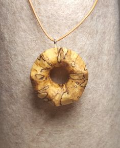 "This is a very cool handmade necklace is made with spalted oak wood. Spalted oak is a really cool thing that happens in wood that makes the different color patterns that you can RARELY find and you can not recreate it, making it perfect for a any occasion gift or a just because gift for yourself. Necklace comes with a 20\" inch PU leather cord with silver plated lobster clasp, you have the choice of different colored cords Black, Khaki & Dark Brown" Earthy Natural Wood Jewelry For Gifts, Earthy Wood Jewelry As Gift, Earthy Wood Jewelry Gift, Wood Pendant Necklace, Earthy Wooden Jewelry Gift, Natural Wood Pendant Jewelry For Gifts, Adjustable Natural Wood Necklaces, Wood Sun, Artisan Natural Wood Pendant Necklace