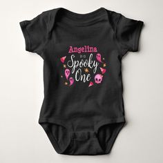 Celebrate your special spooky ghoul's 1st birthday with this cute one piece black bodysuit featuring the title "Spooky One", a cute pink skeleton, ghosts, candy corn and stars, and your baby's name. Simply personalize with your little one's name to make it your own. A fun outfit that is perfect for birthdays in the fall or Halloween. Fitted Black Onesie With Name Print, Cute Black Halloween Onesie, Halloween 1st Birthday Party, Halloween 1st Birthdays, Spooky One, Mermaid Cat, Personalized Baby Clothes, Princess Baby