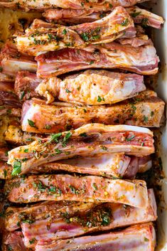 meat in a casserole dish with herbs and seasoning