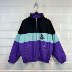 Vintage Size S - L Windbreaker light Jacket Sportsjacket 80s 90s Unlined vintage windbreaker in size S - M (men) or M - L (women), closes with a zipper, one zipped pocket on the right and left Colour: black pastel turquoise purple yellow Defects: none Dimensions: Length 69cm Width 64cm Arm length from collar 76 cm If you have any questions, just write to me :) Pastel Turquoise, Black Pastel, Vintage Windbreaker, Turquoise And Purple, Light Jacket, Favorite Outfit, Mens Jackets, Art Collection, Bathing Beauties