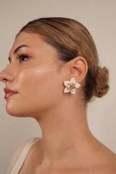 Step into a garden of elegance with our Blooming White Magnolia Earrings - a delicate ode to nature's beauty. Crafted with meticulous attention to detail, these earrings feature realistic magnolia flowers, capturing the essence of a blossoming garden. Perfect for bridesmaids or as a thoughtful birthday gift, these earrings are more than accessories; they are a symbol of appreciation and natural grace. The intricate petals showcase the artistry of nature, while the overall design exudes a timeles Magnolia Earrings, Bridesmaid Thank You, Magnolia Flowers, Jewelry Delicate, White Magnolia, Bridal Event, Magnolia Flower, Wedding Jewelry Earrings, Flower Jewelry