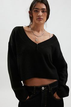 Forever staple BDG sweater in an effortless pull-over style. Designed in a boxy & cropped fit featuring a wide v-neckline and drop shoulders for a slouchy look. Finished with ribbed knit trim. Find it only at Urban Outfitters. Features BDG Jenna v neck sweater Slouchy sweater Soft and stretchy knit Wide v-neckline and long sleeves with ribbed knit trim Ribbed knit hem Boxy, relaxed fit Cropped length Easy pull-over style UO exclusive Contents + Care 53% Recycled polyester, 47% polyester Machine Relaxed Fit V-neck Crop Top, Bdg Sweater, Cable Knit Sweater Outfit, V Neck Cable Knit Sweater, Black Cropped Sweater, Knit Sweater Outfit, Slouchy Sweater, Cable Knit Sweater, Small Chest