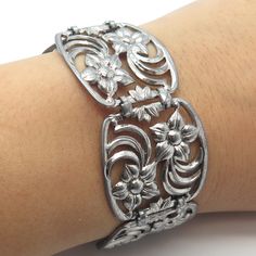 Great vintage condition.  925 Sterling Silver Vintage W. E. Richards Floral Panel Link Bracelet 7.75"  Weight: 37.6g   WELCOME TO PAWN SHOP We are an actual pawn shop and have been in business for over 25 years. Since 1990, our establishment has been serving a variety of clients by providing them with short term cash solutions and options of liquidity regarding their treasured heirlooms. Acknowledging that today′s customers are very sophisticated and are looking for a variety of investments, our Classic Engraved Sterling Silver Bracelet, Engraved Sterling Silver Bracelet Collectible, Vintage Sterling Silver Bracelet For Anniversary, Vintage White Gold Bracelet With Intricate Design, Vintage Oxidized Antique Silver Bracelet, Vintage White Gold Bracelets With Intricate Design, Vintage Silver Bracelet With Oxidized Finish, Vintage Antique Silver Sterling Bracelet, Vintage Sterling Silver Bracelet In Antique Silver