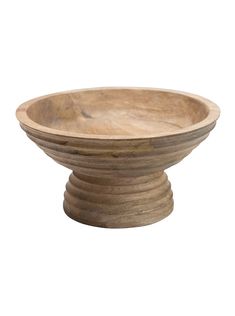 a wooden bowl sitting on top of a table