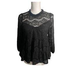 Monteau Los Angeles Size Medium Black Lace Tiered Blouse New. Has Layered Sold Tank And Top Tiered Later Of Beautiful Black Lace. Measurements: Shoulder To Bottom Of Sleeve Is Approximately 22”, Length Approximately 22”, And Pit To Pit Approximately 19” Single Button In Back. This Top Is In Excellent Condition. Msrp Over $100 Black Lace Top For Layering, Black Lace Tops For Layering, Black Lace Tops With Ruffles, Chic Black Lace Top With Ruffles, Black Long Sleeve Lace Top For Layering, Chic Black Lace Blouse, Chic Black Blouse With Lace Trim, Chic Black Blouse With Lace Top, Casual Black Lace Blouse