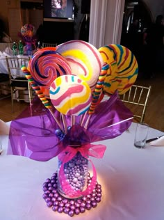 there is a candy bouquet on the table at this party, it's very colorful