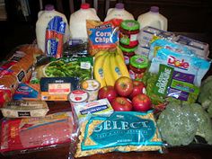 a table topped with lots of groceries and milks on top of eachother