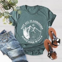 a t - shirt that says not all classrooms have four walls with trees on it