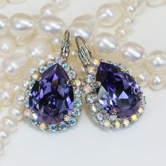 Purple Crystal Drop Earrings, Dangle Teardrop Earrings, Purple Jewelry, AB Halo Bridesmaids Gift, Bridal Wedding Jewelry, Tanzanite, SE101 Super sparkly bridal earrings! A sparkly pair of leverback drop earrings made with genuine 13/18mm premium high quality crystals. Surrounded by small sparkling crystals. Total size of the earring: Length 30mm Width: 16mm Sparkly and Colorful, Hard to ignore. Check the additional photos to choose more colors. There are matching necklaces rings and bracelets to Purple Crystal Earrings For Wedding, Purple Teardrop Earrings For Wedding, Purple Dangle Teardrop Earrings For Wedding, Purple Drop Earrings For Wedding, Purple Wedding Teardrop Earrings, Purple Teardrop Crystal Earrings For Wedding, Teardrop Bridal Earrings For Celebrations, Purple Dangle Bridal Earrings For Wedding, Purple Teardrop Crystal Earrings For Formal Occasions