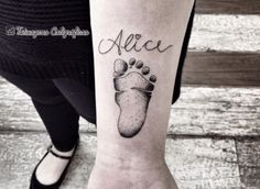 a woman's foot with the word alice written in cursive writing on it