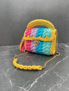 Title: Colourful Crossbody bag, Multi Color Bag, Hand Woven Crossbody Bag, Crochet Shoulder Bag, Luxury Cotton Bag, Cotton Purse,Handmade gift, Gift for her Strap - 100 cm Height: 18-20cm  Length: 22-23cm ✨FUNCTIONAL USE: Bags Planet bohemian purse has two different uses, both as a hand bag and as a crossbody bag. In the summer months, you can use this color bag according to the invitation you will attend by making a handbag. 🧼WASHING: It is not recommended to wash the Bags Planet yarn bag in the washing machine because the accessories are damaged after washing. It is recommended to clean it with a damp cloth. 🎁A UNIQUE GIFT: This unique knitted bag has a stylish look with its unique design. You can show your value to your loved ones by gifting this hobo bag to your loved ones on special Luxury Yellow Pouch Shoulder Bag, Yarn Purse, Crossbody Bag Crochet, Pouch Crochet, Bohemian Purse, Multi Colored Bag, Purse Crochet, Cotton Purse, Gift Luxury